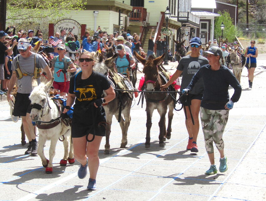Racers and burros leave the starting line.